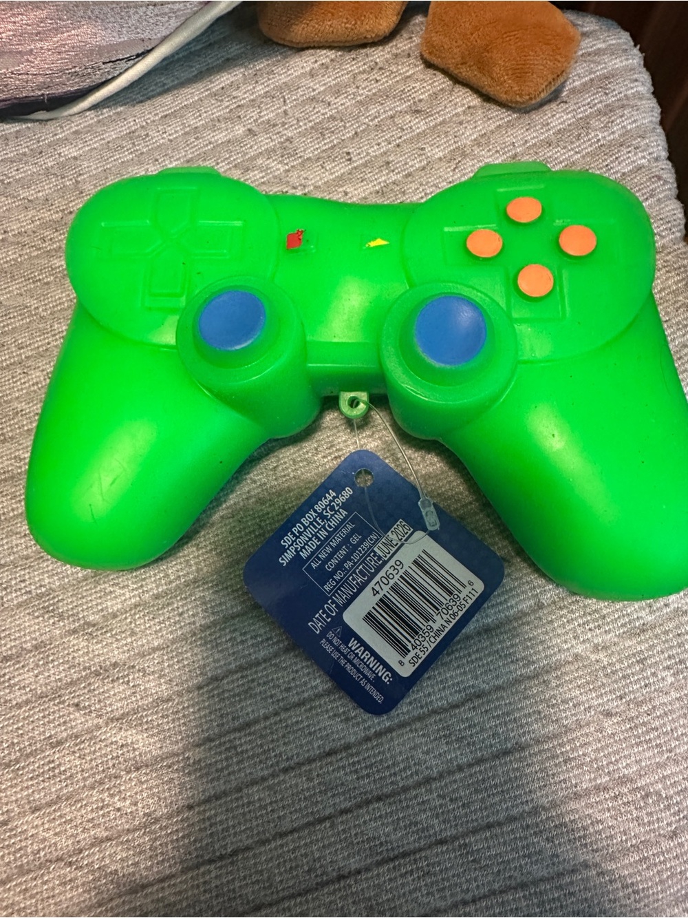 Bright Green Wireless Game Controller with Blue Thumbsticks and Orange Buttons